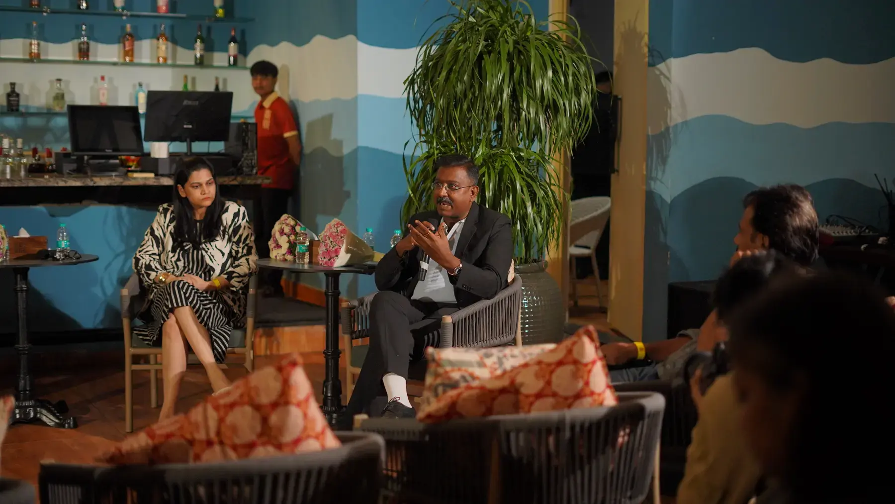 A wider view of the seated room during the panel discussion